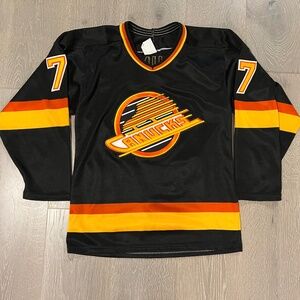 Vancouver Canucks CCM black skate logo, size small, Dan Quinn #7